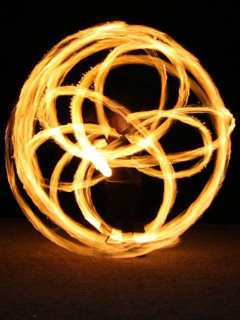 Chris playing poi
